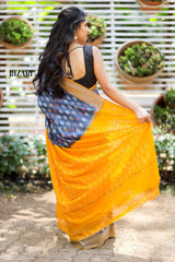 Blue Ikat Pochampalli saree with mustard border and Pallu