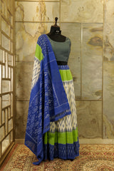 Off White with vibrant green and blue border and blue Pallu Ikat Pochampalli Saree