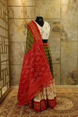 Moss green Ikat Pochampalli with red and Off White color sections