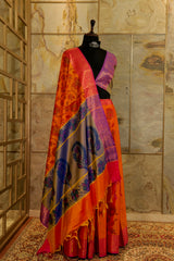 Orange dual-tones Pochampalli super soft saree with contrast purple-gold blouse