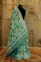 Pastel green cotton jamdani with white and gold floral design weaved all over saree