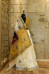 Hand painted Off White saree with Beige colored Pallu with batik lady figurine on Pallu and painted motifs all over body