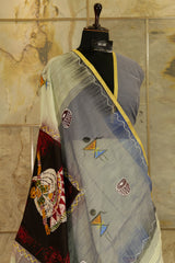 hand painted Pastel green cotton saree with grey pallu- with Batik lady figurine on Pallu