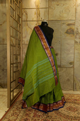 Green shade chettinad cotton saree  with purple borders on both the sides with peacock design in silver and golden weaving