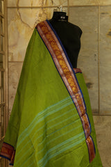 Green shade chettinad cotton saree  with purple borders on both the sides with peacock design in silver and golden weaving
