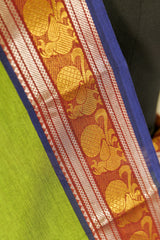 Green shade chettinad cotton saree  with purple borders on both the sides with peacock design in silver and golden weaving