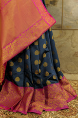 Dark blue banarasi with dark pink border and dark pink Pallu with rich golden work all over Pallu