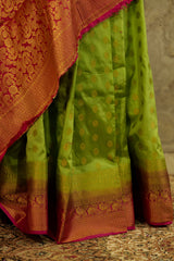 Green soft silk banarasi all over buttas with contrast pink brocade Pallu and pink brocade blouse