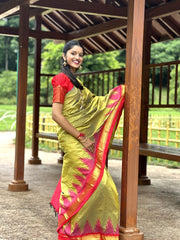Olive green Kanjivaram Silk Saree with Pink Temple Border