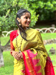 Olive green Kanjivaram Silk Saree with Pink Temple Border