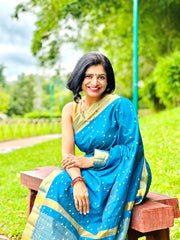 Blue Tussar Saree with golden Jari Butti all over body and Jari borders