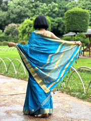 Blue Tussar Saree with golden Jari Butti all over body and Jari borders