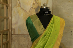 Green  Saree with  all over Buttis and Dark Green Contrast Pallu