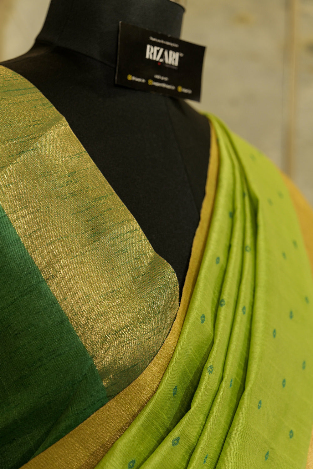 Green  Saree with  all over Buttis and Dark Green Contrast Pallu