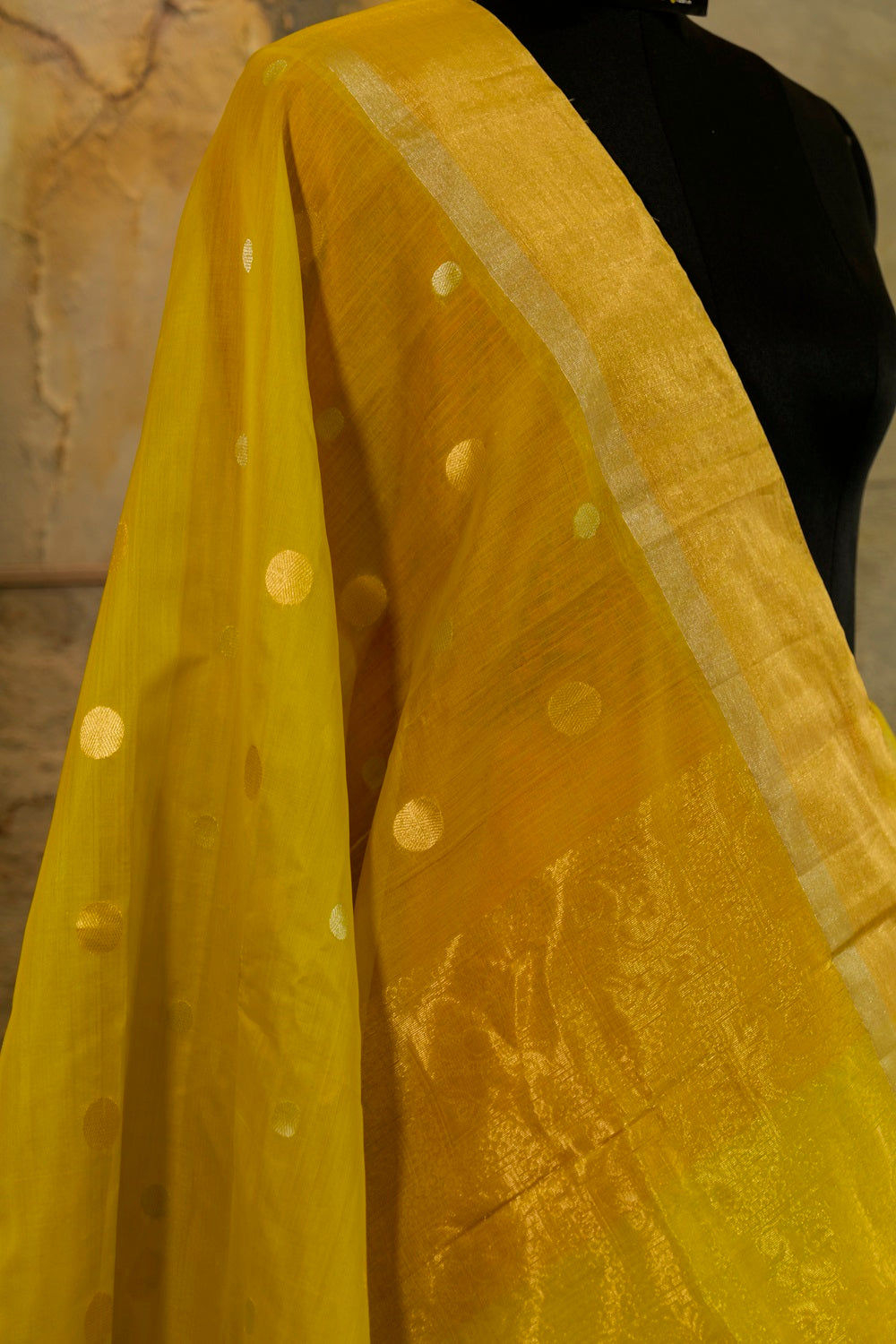 Olive green shade Handwoven Kanjivaram Saree with silver and golden Jari Butta all over