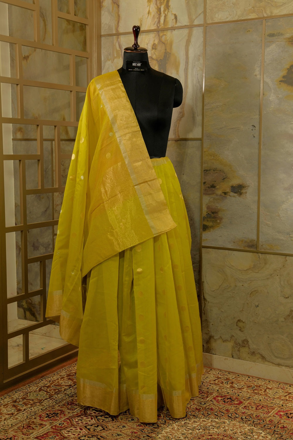 Olive green shade Handwoven Kanjivaram Saree with silver and golden Jari Butta all over