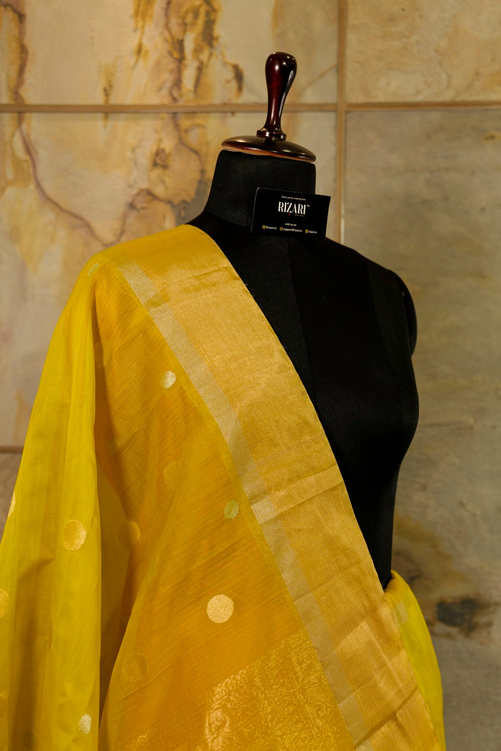 Olive green shade Handwoven Kanjivaram Saree with silver and golden Jari Butta all over