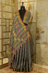 Charcoal Linen saree with Jari border and geometric weaving pattern on Pallu