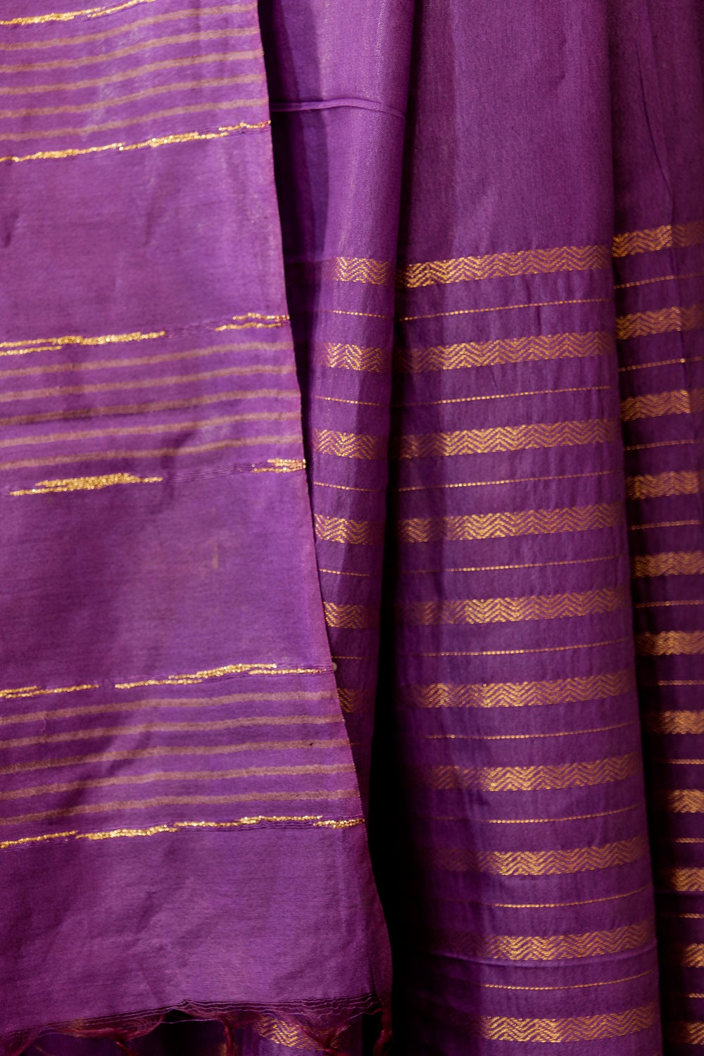 Purple Saree with Jari borders and horizontal Jari stripes and beautiful golden lining on Pallu with tasseled fringe