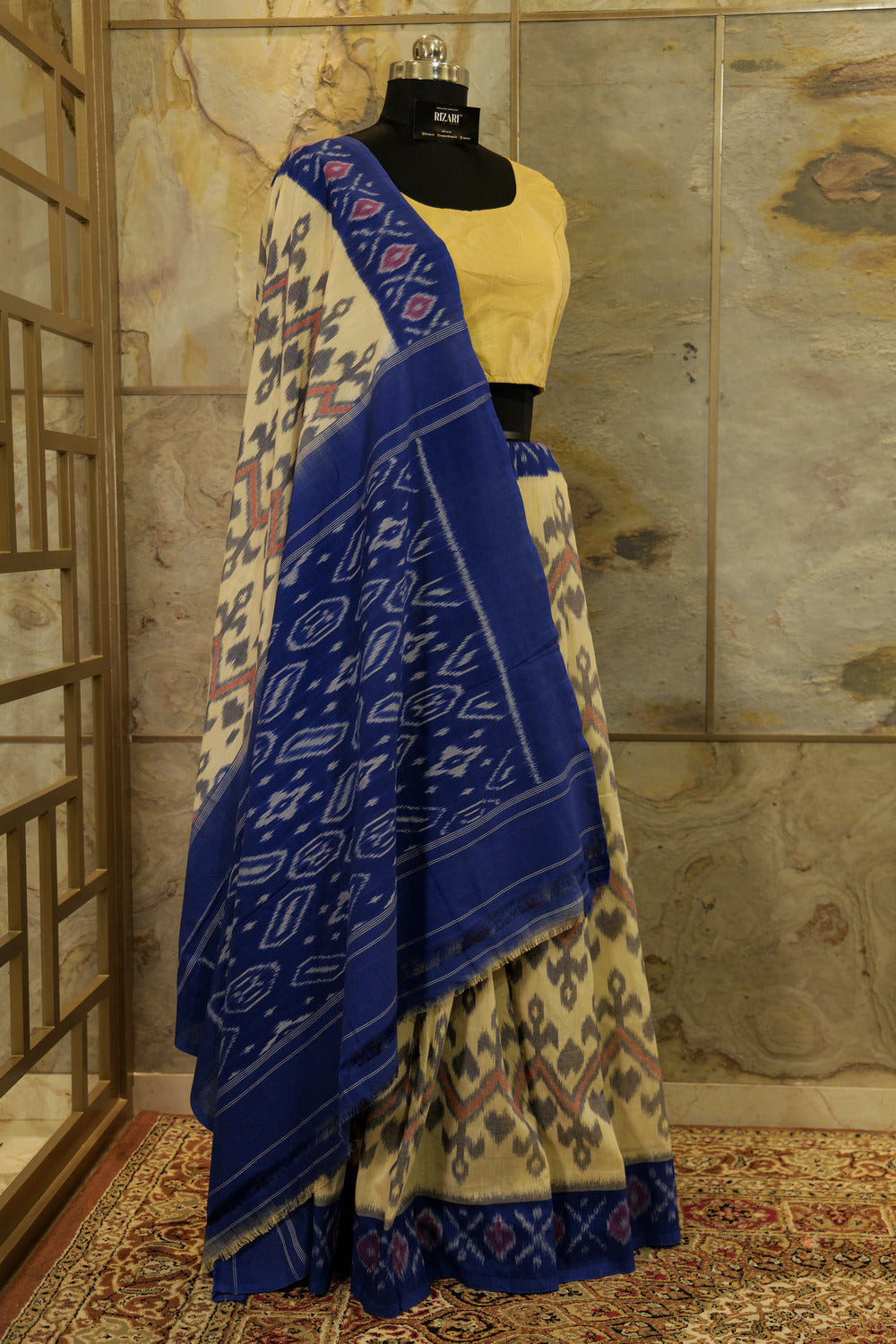 Off-White Ikat Pochampalli handwoven saree with blue border and Pallu