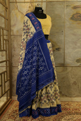 Off-White Ikat Pochampalli handwoven saree with blue border and Pallu