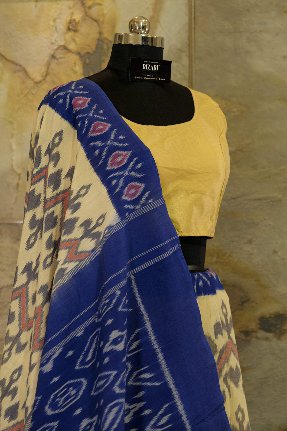 Off-White Ikat Pochampalli handwoven saree with blue border and Pallu