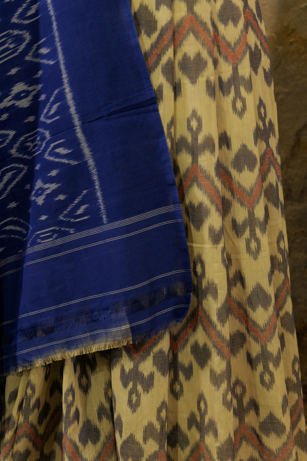 Off-White Ikat Pochampalli handwoven saree with blue border and Pallu