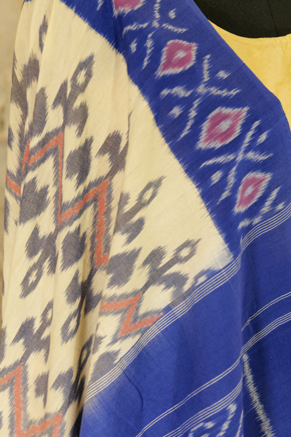 Off-White Ikat Pochampalli handwoven saree with blue border and Pallu