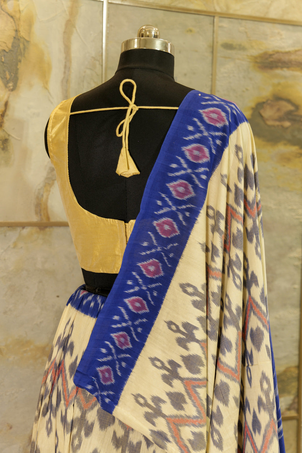 Off-White Ikat Pochampalli handwoven saree with blue border and Pallu