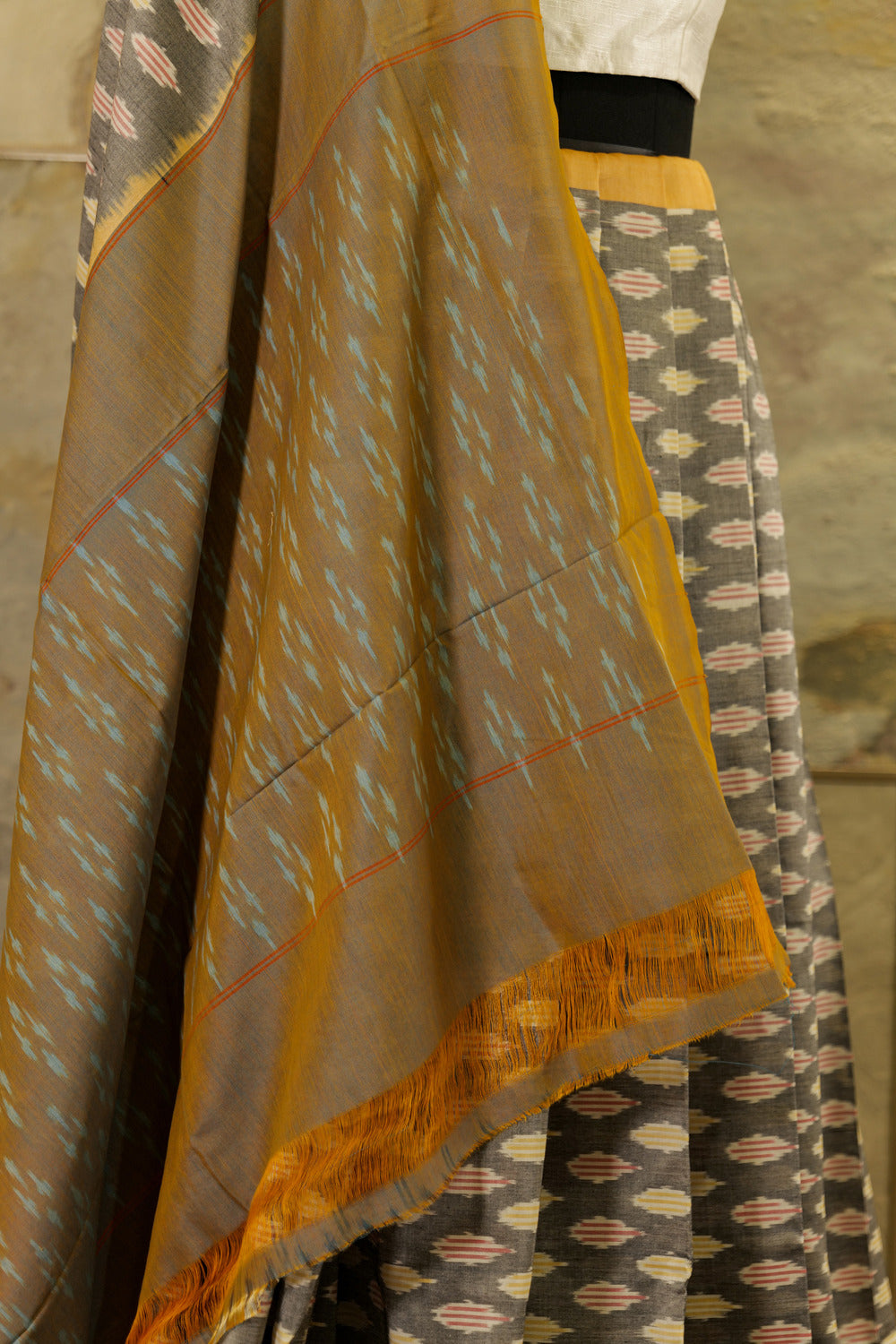 Grey Ikat Pochampalli saree with mustard border and dual tone Pallu