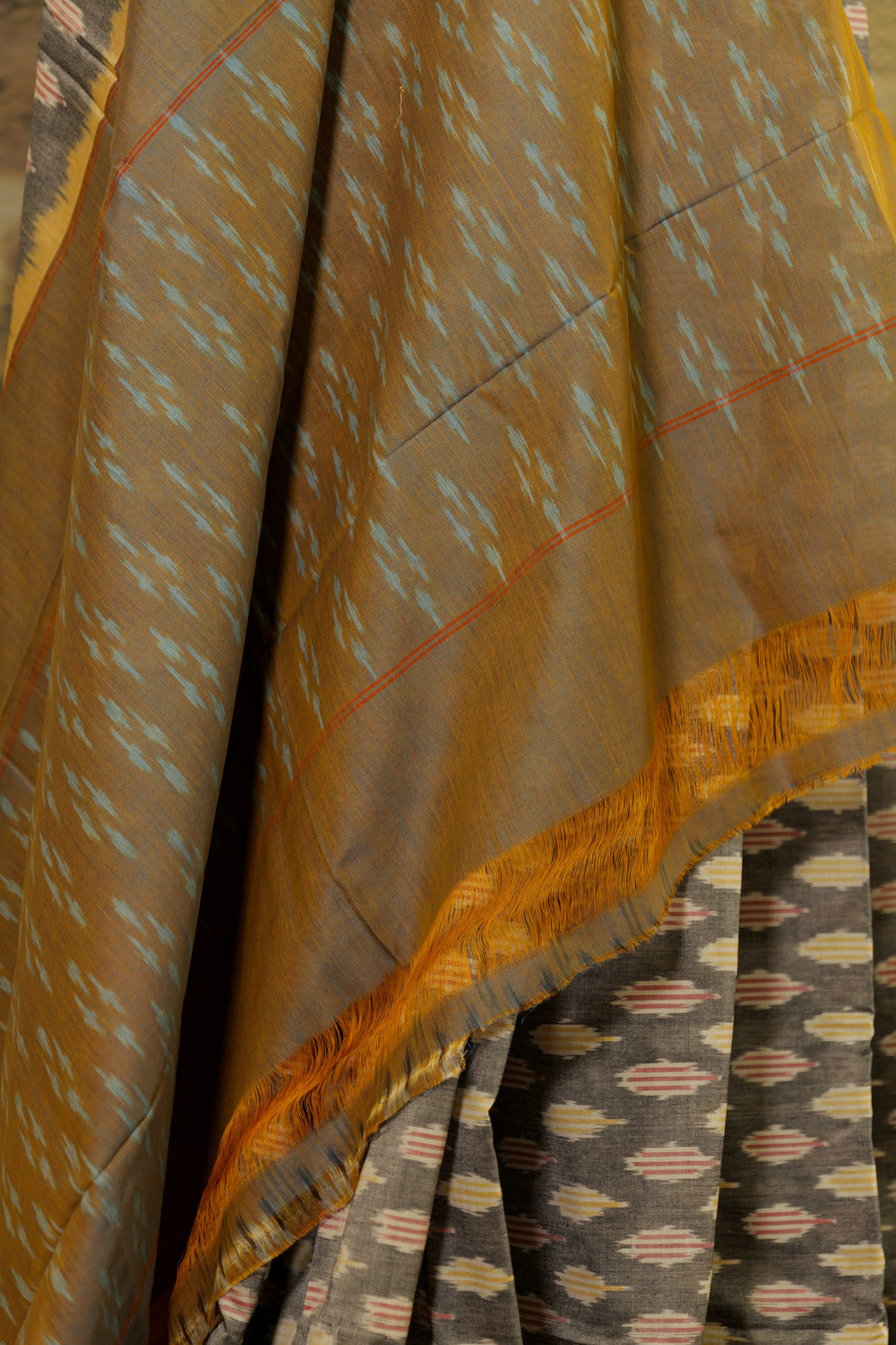 Grey Ikat Pochampalli saree with mustard border and dual tone Pallu