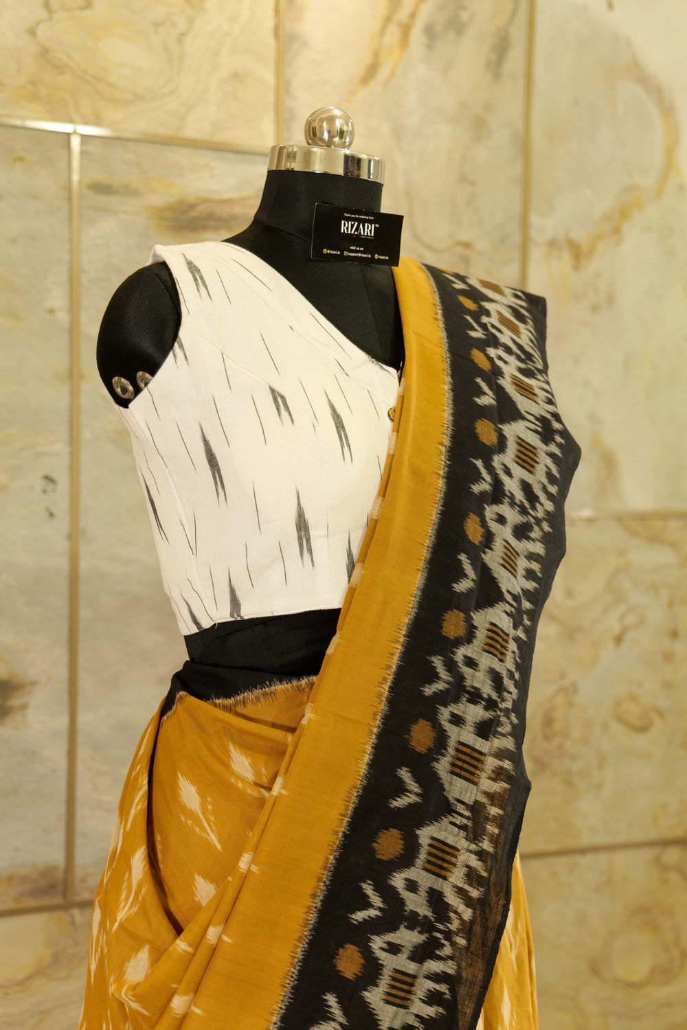 Mustard Ikat Pochampalli  with black border with elephant figurines on border and black Pallu