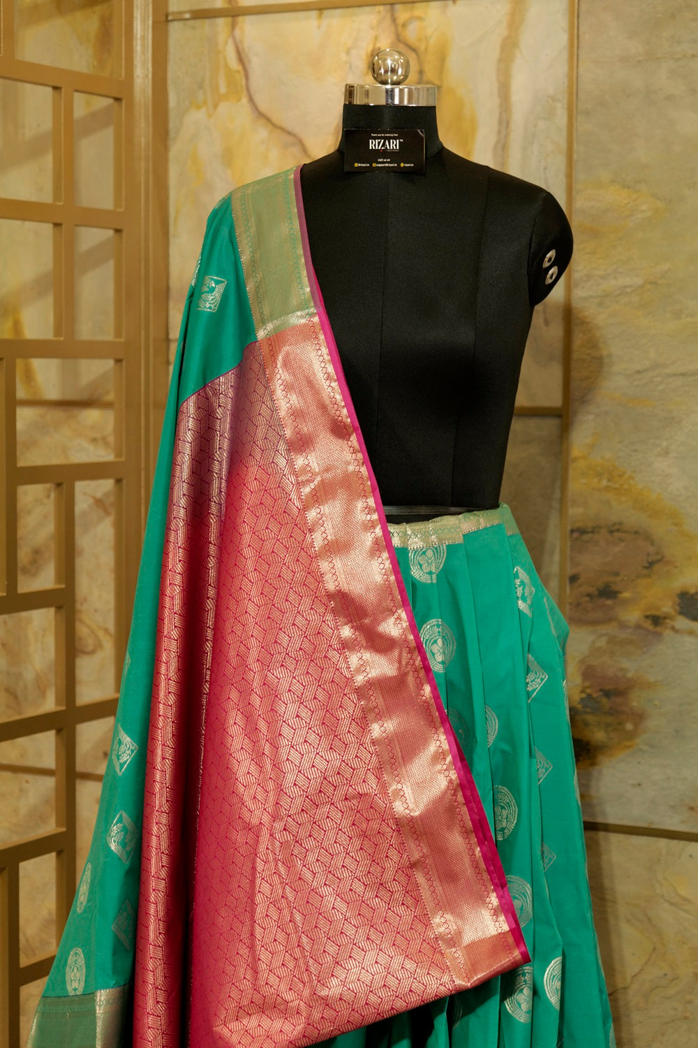 Peacock green & Pink Kanchi Silk saree with emboss buttas