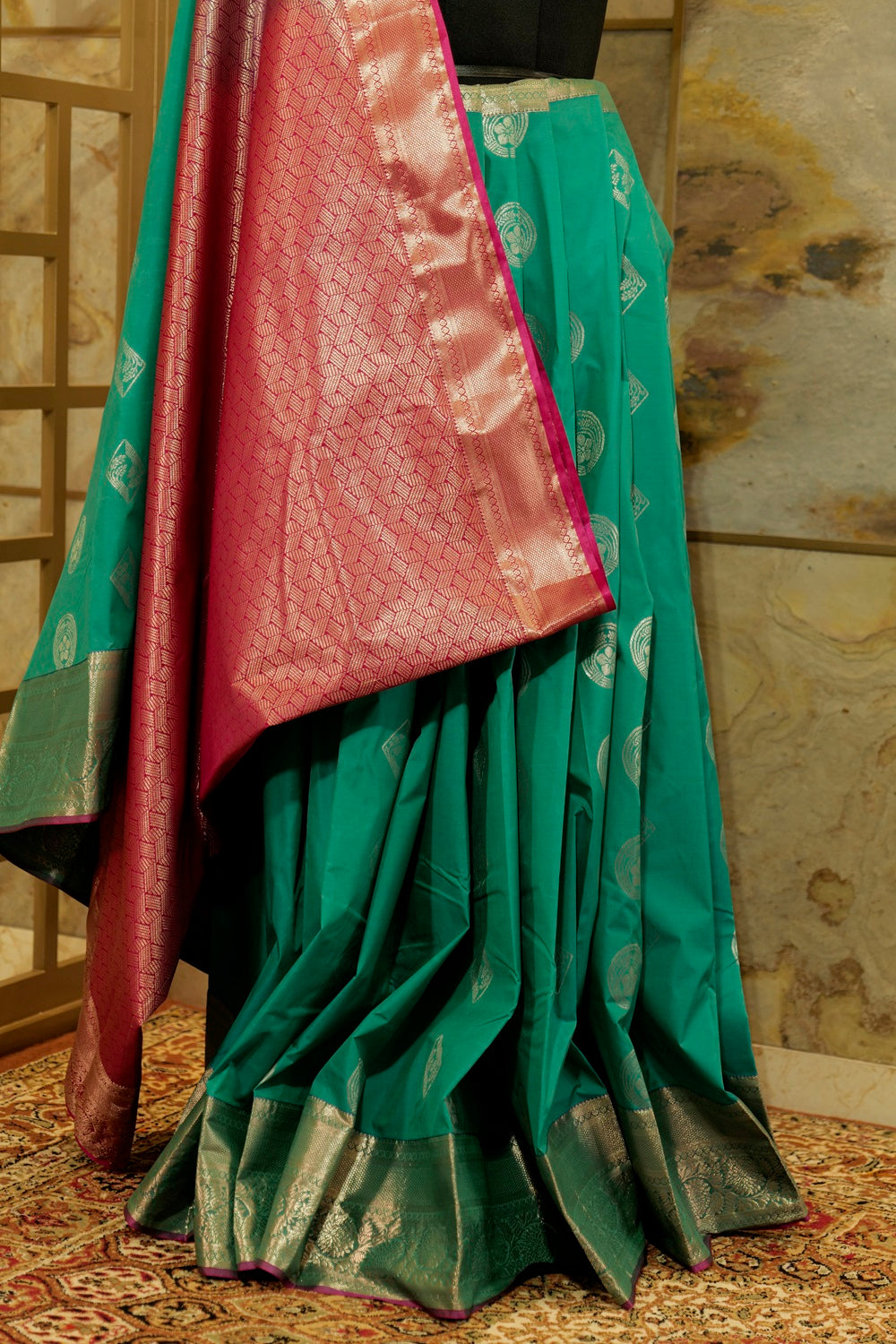 Peacock green & Pink Kanchi Silk saree with emboss buttas