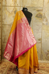 Mustard Kanchi silk saree with contrast pink Pallu and blouse rich jacquard borders on the sides