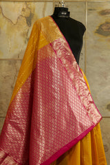 Mustard Kanchi silk saree with contrast pink Pallu and blouse rich jacquard borders on the sides