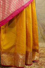 Mustard Kanchi silk saree with contrast pink Pallu and blouse rich jacquard borders on the sides