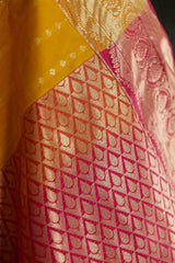 Mustard Kanchi silk saree with contrast pink Pallu and blouse rich jacquard borders on the sides