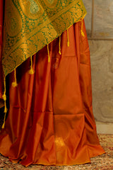 Soft silk orange-mustard shade saree with contrast green brocade Pallu