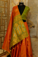 Soft silk orange-mustard shade saree with contrast green brocade Pallu