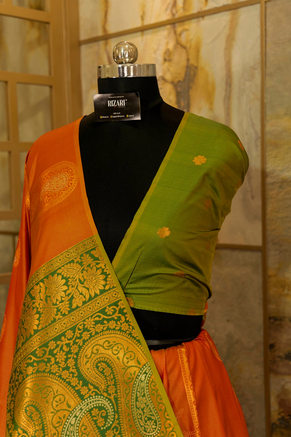 Soft silk orange-mustard shade saree with contrast green brocade Pallu