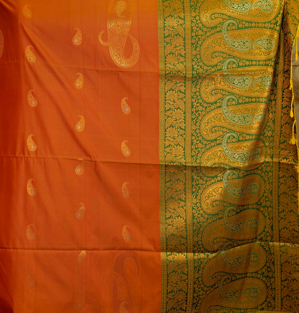 Soft silk orange-mustard shade saree with contrast green brocade Pallu