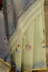 hand painted Pastel green cotton saree with grey pallu-  with Batik lady figurine on Pallu