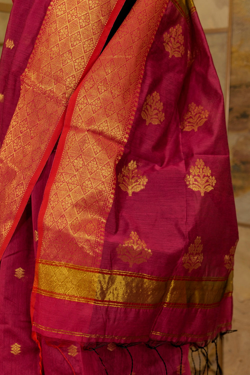 Rani pink Maheshwari cotton with Jari buttas all over and broad borders on both the sides