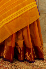 Brown-purple dual tones chettinad cotton saree with dark brown border on one side with bird figure woven inside a circle