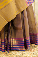 Dual toned brown-orange chettinad cotton saree with purple contrast temple borders on both the sides