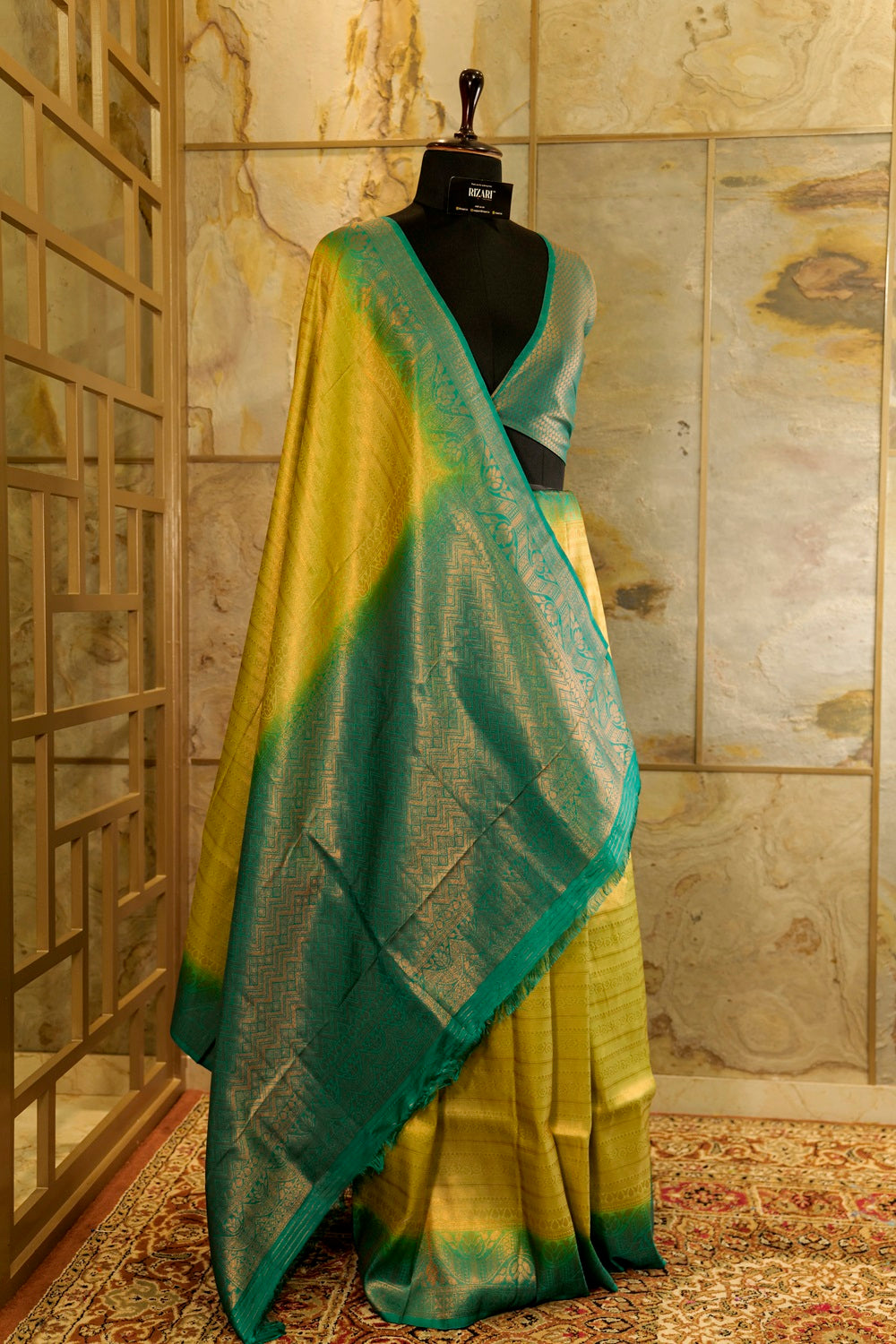 Yellow banarasi with contrast teal green rich brocade Pallu and plain teal green blouse .