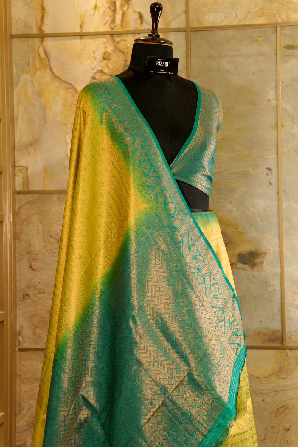 Yellow banarasi with contrast teal green rich brocade Pallu and plain teal green blouse .