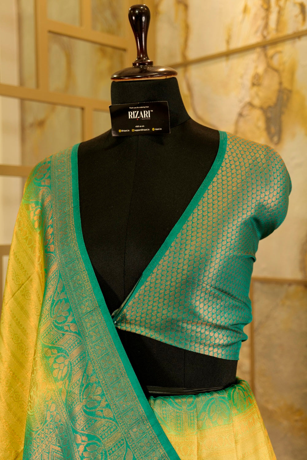 Yellow banarasi with contrast teal green rich brocade Pallu and plain teal green blouse .