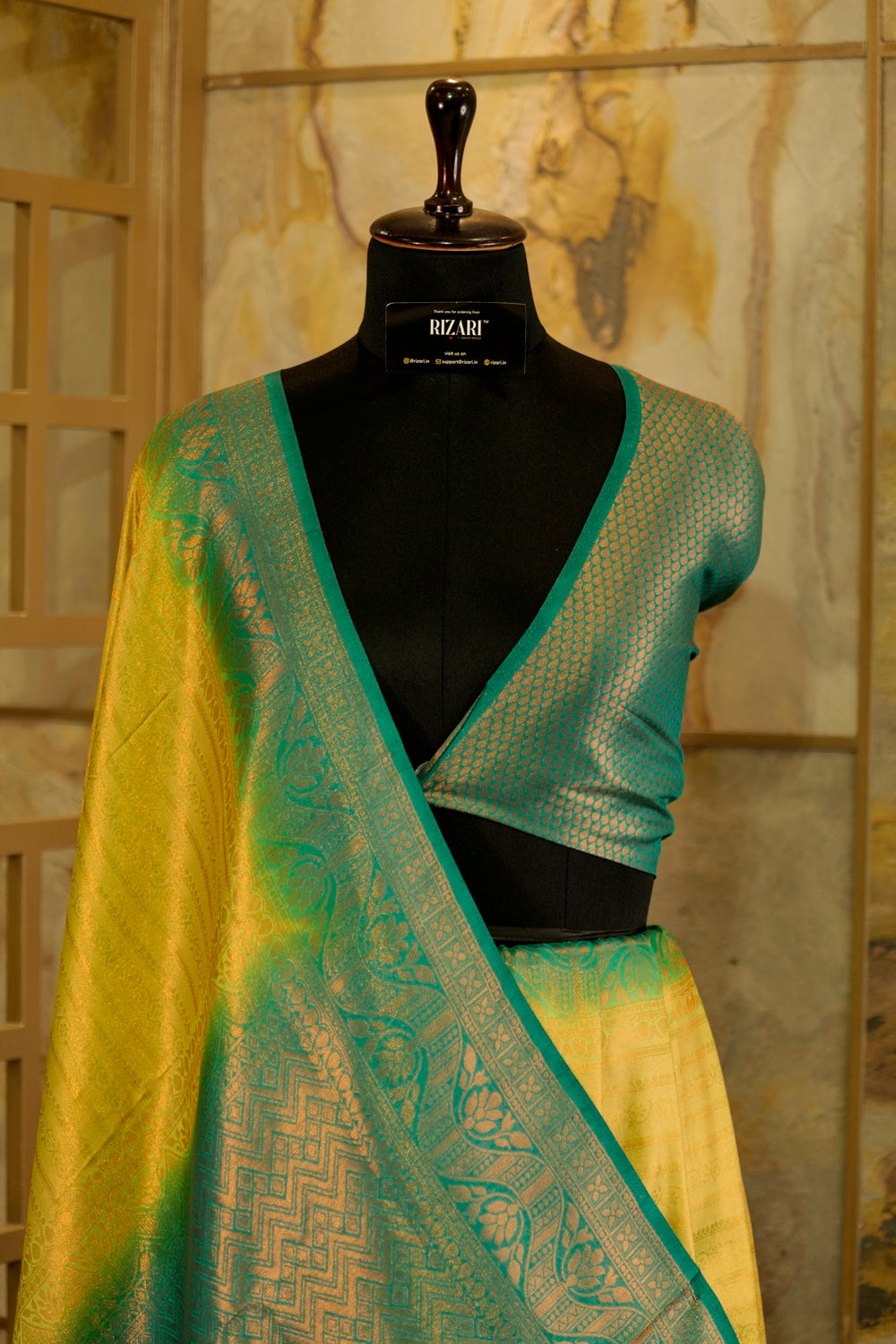 Yellow banarasi with contrast teal green rich brocade Pallu and plain teal green blouse .